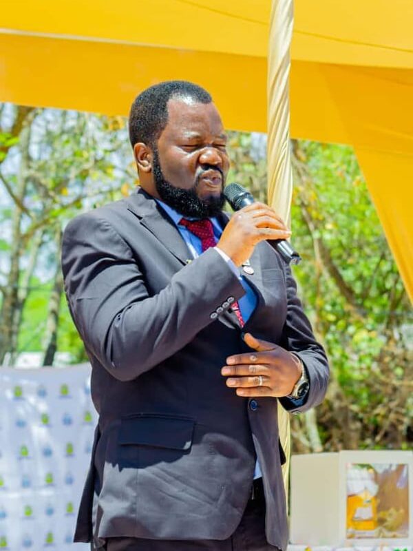 Benson Mukandiwa speaking at an outdoor professional event